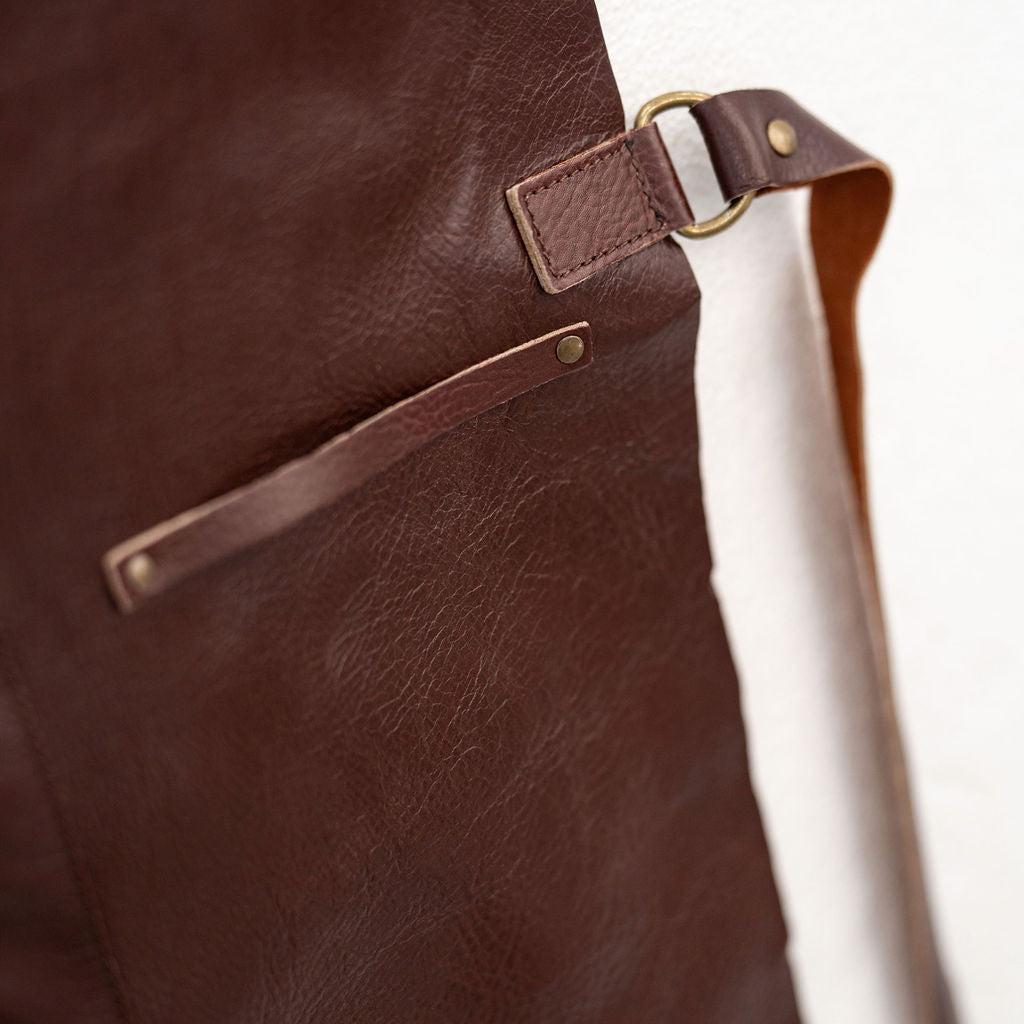 Premium chestnut leather apron designed for cooking crafting and studio work