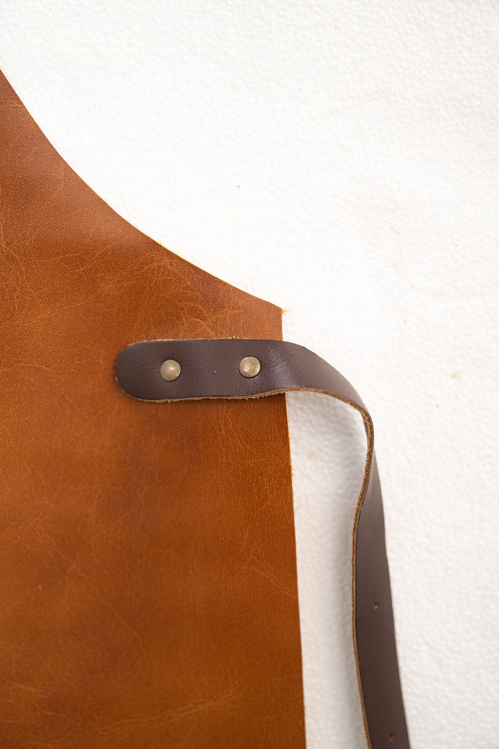 High quality saddle brown leather apron with strong stitching detail