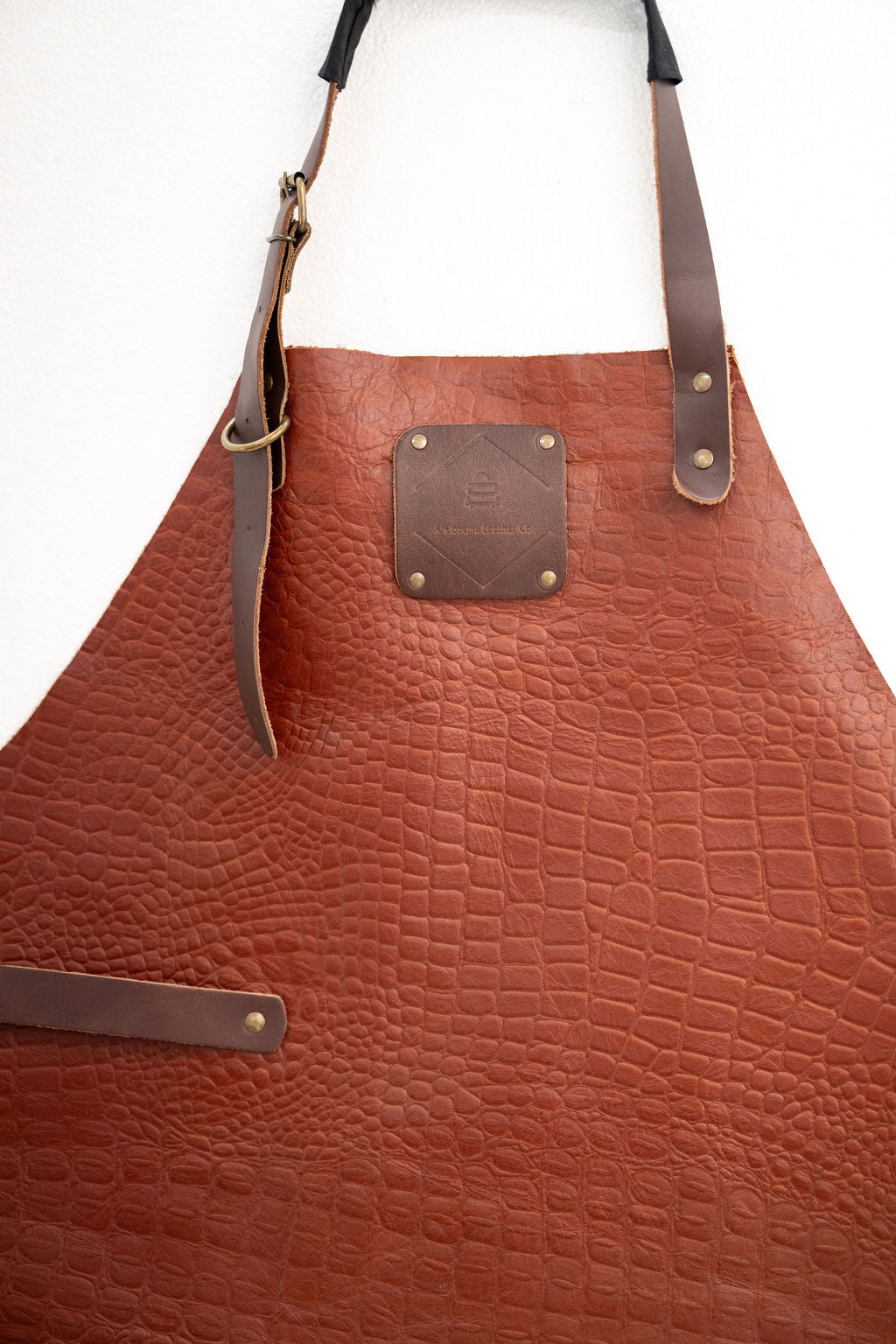 Luxury textured leather apron with crocodile pattern design