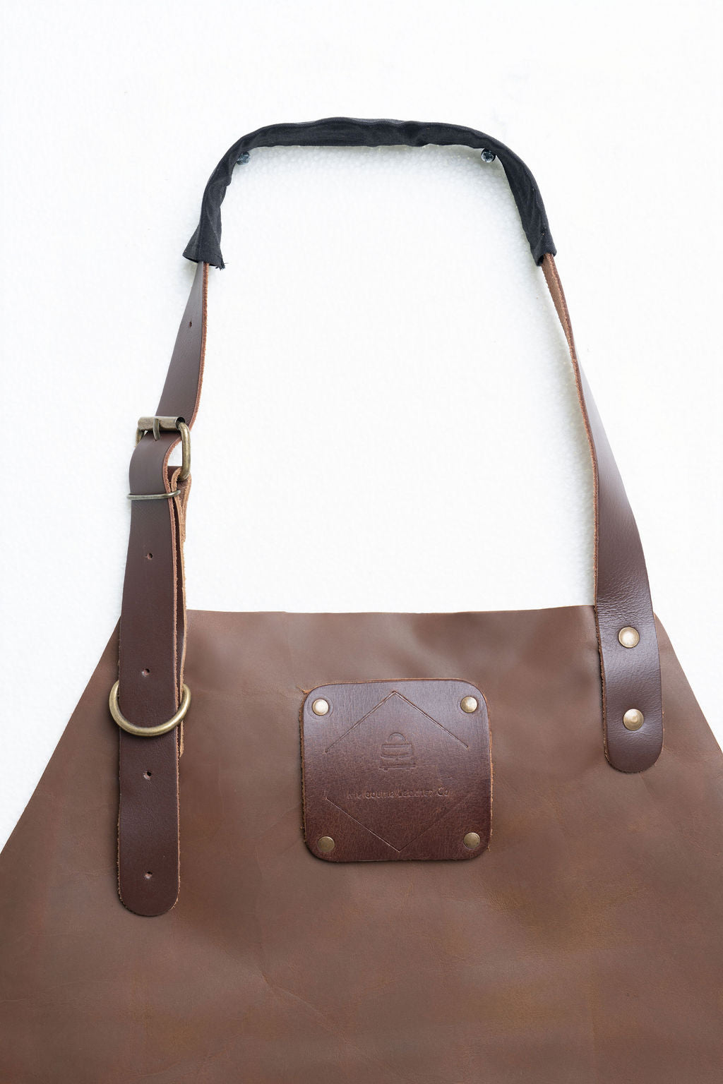Comfortable adjustable leather apron in brown for cooking and barbers