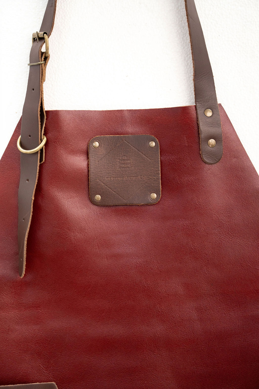 Modern red leather apron minimal design for woodworking and DIY