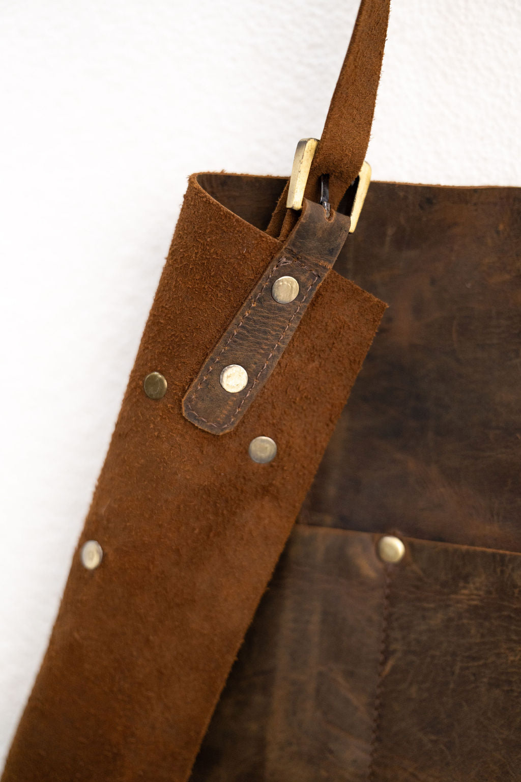 Full length brown leather apron with pockets for woodworking and BBQ