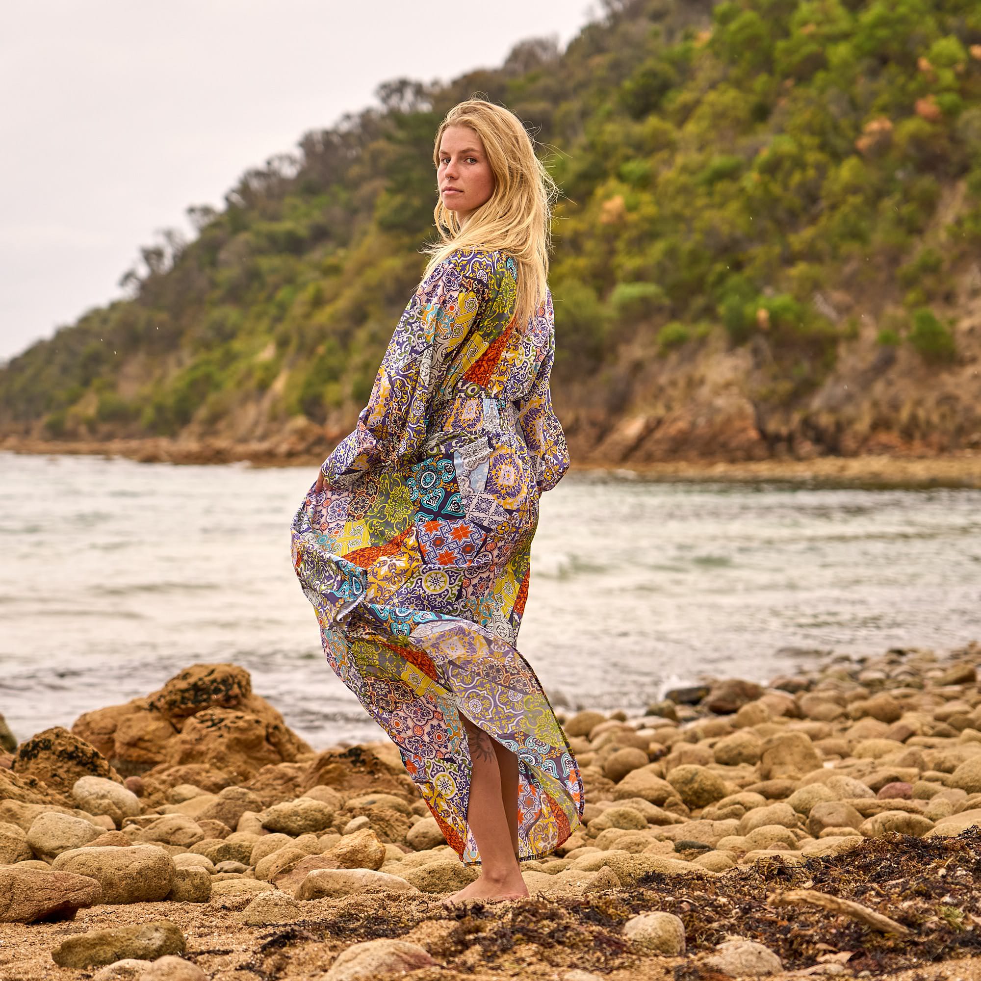 Elegant cotton patchwork maxi dress with handcrafted details, perfect for boho beachwear and resort style.