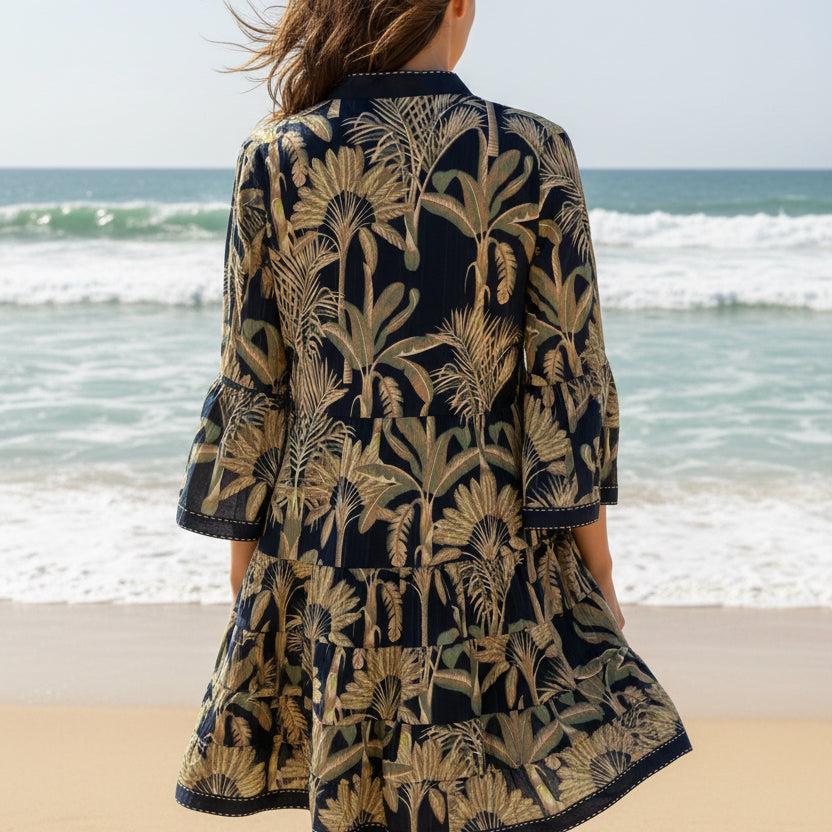 Boho tropical cotton mini dress with tiered shirt design, side view