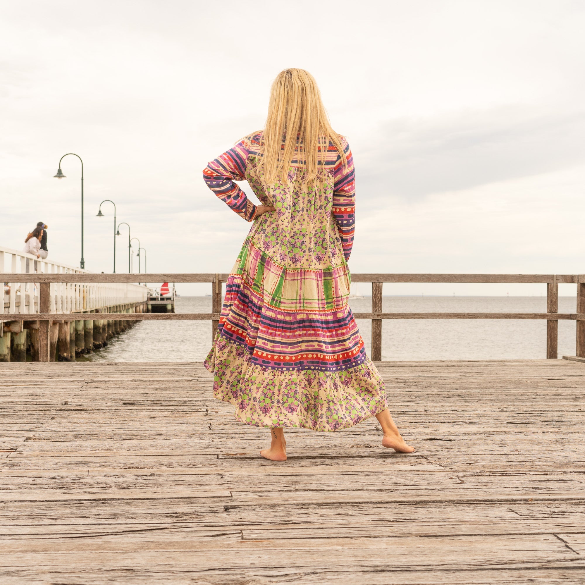 Bohemian luxe maxi dress featuring colorful floral patchwork design
