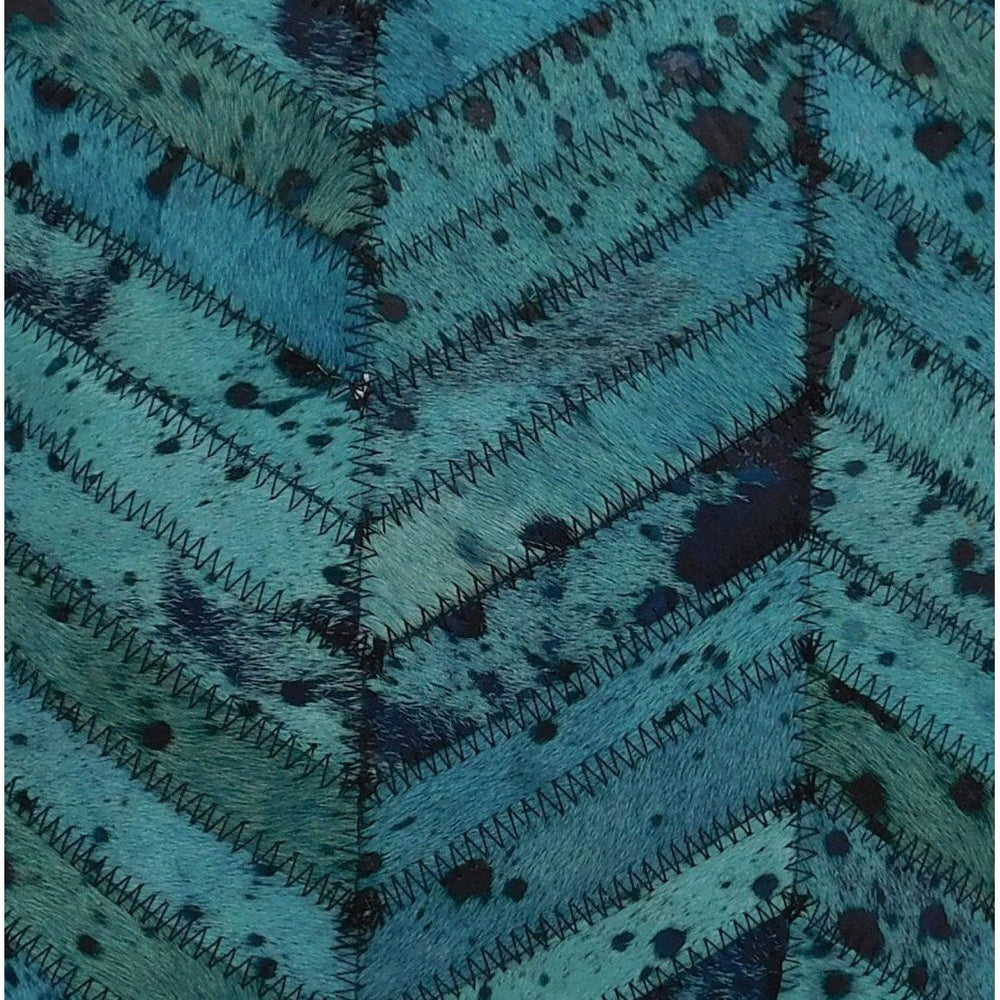 40x40cm teal cowhide cushion cover layered in relaxed boho interior