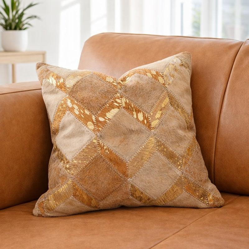 Boho gold check cowhide leather cushion cover with tan and neutral patchwork, featuring luxe gold detailing.