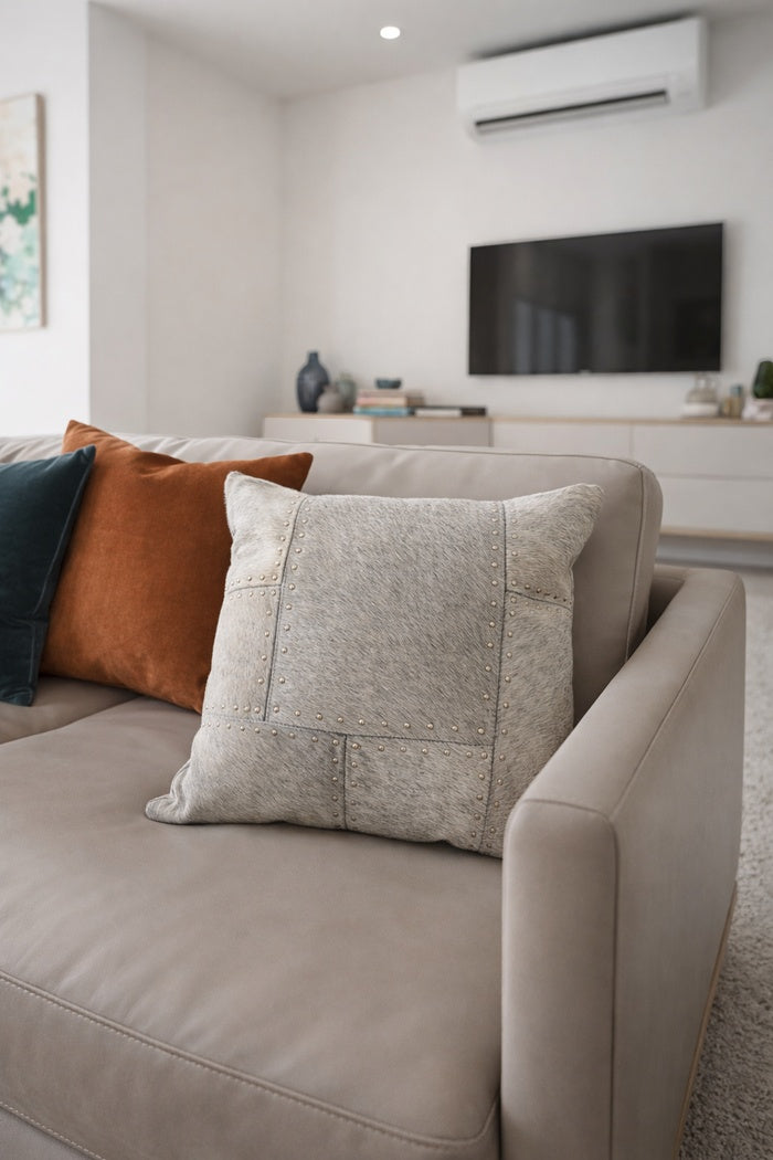 Handcrafted studded cowhide leather patchwork cushion cover for boho eclectic decor