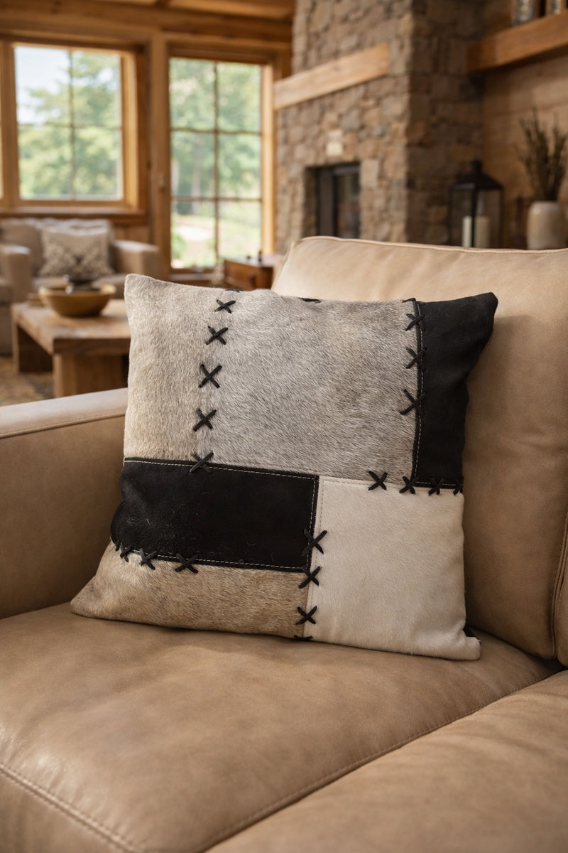 Cowhide cushion cover 45x45cm in black, grey and cream patchwork with decorative X-stitch detail