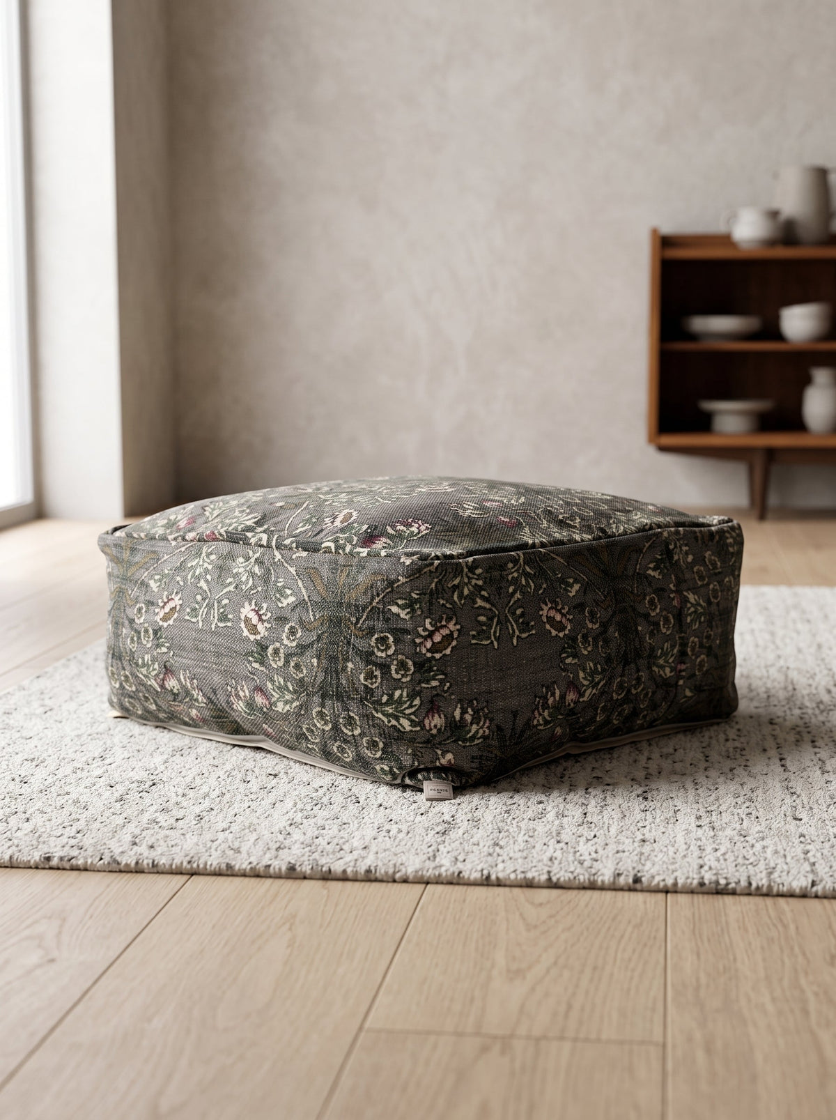 Charcoal floral floor pouf with Moroccan-inspired boho design