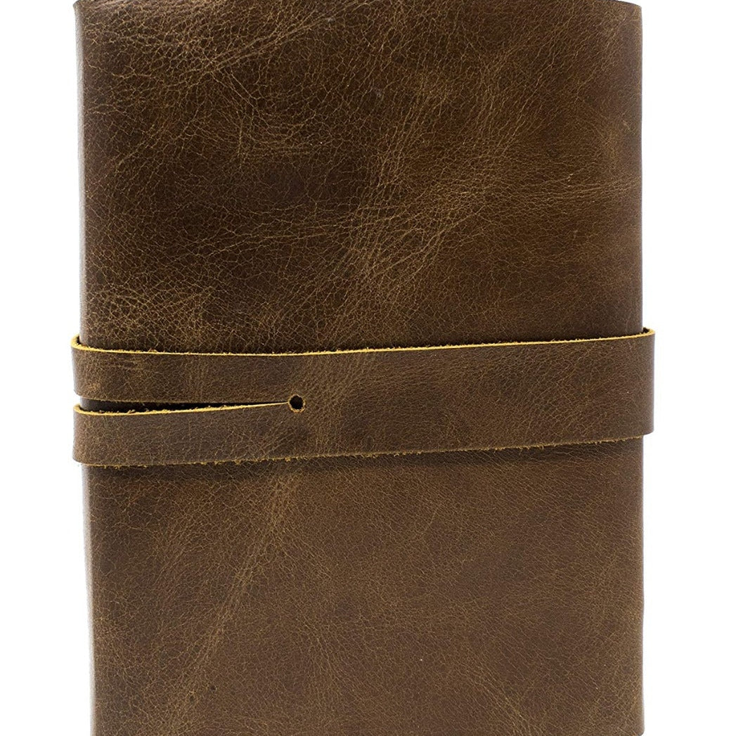 Vintage brown genuine leather journal with a wrap-around strap closure.