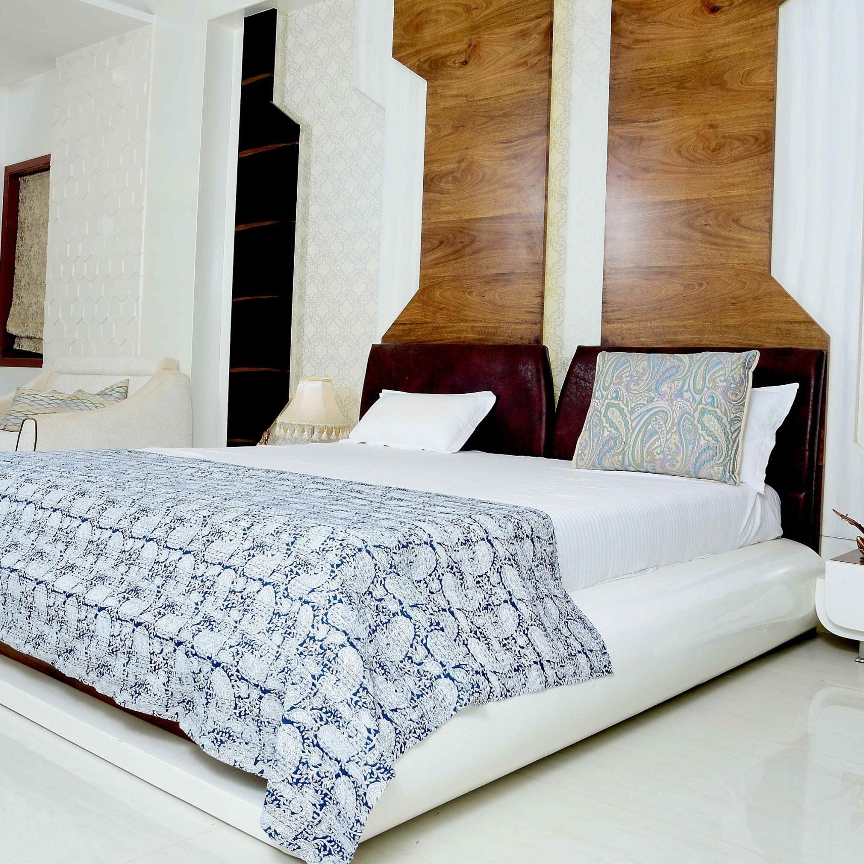 Celestial Blue Kantha Quilt on a white king-size bed, featuring a boho-style pattern and reversible design.