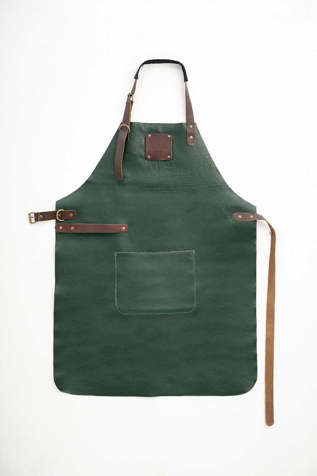 Durable forest green leather work apron for woodworking and crafting