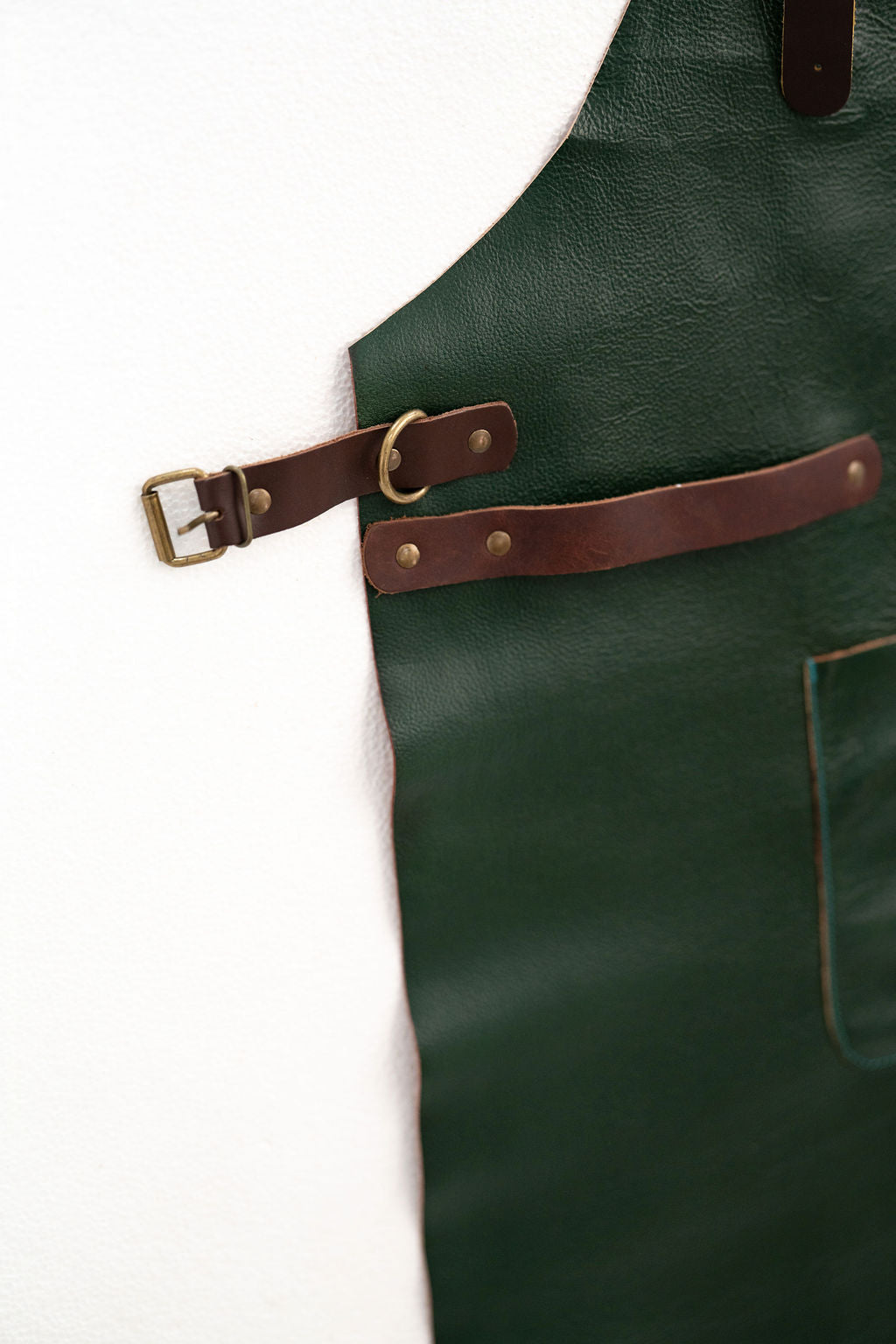 Full coverage forest green leather apron for kitchen and workshop use
