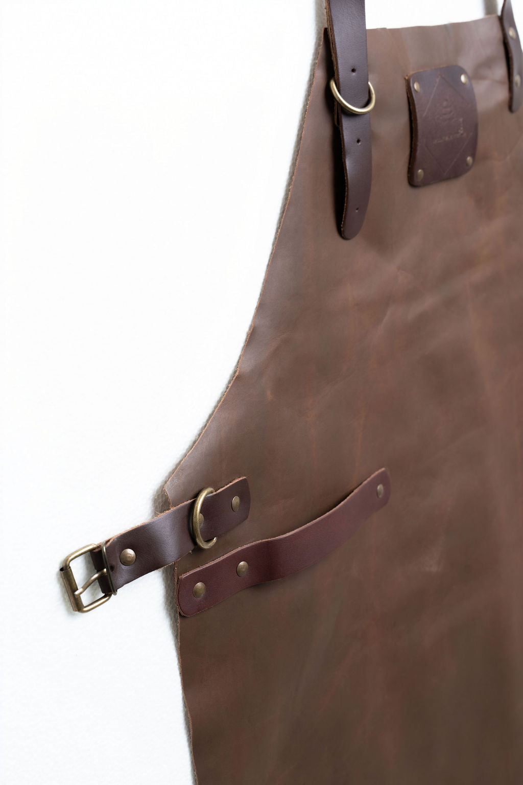 Heavy-duty brown leather apron with full coverage and adjustable straps