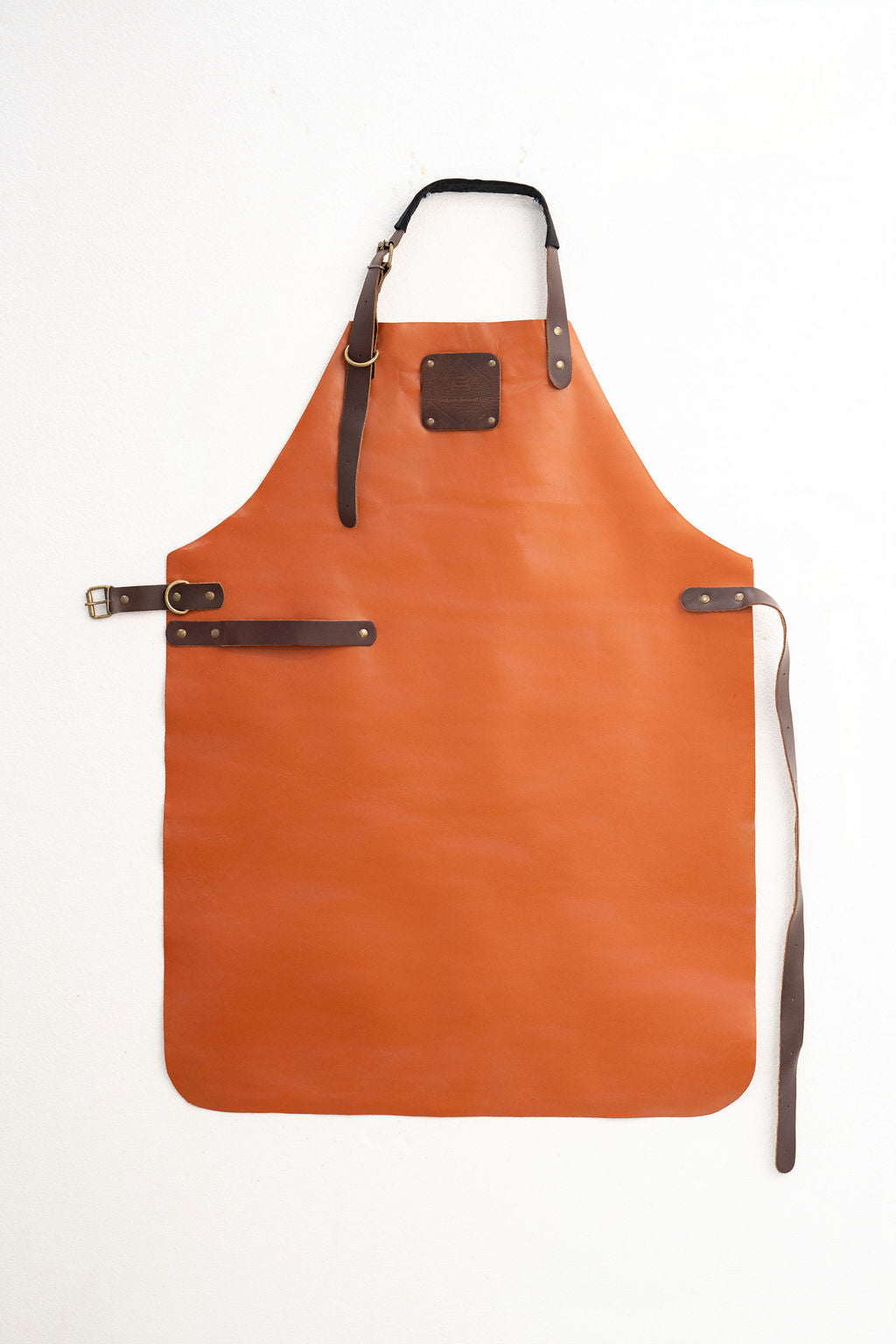 Durable cognac leather apron for woodworking and workshop use