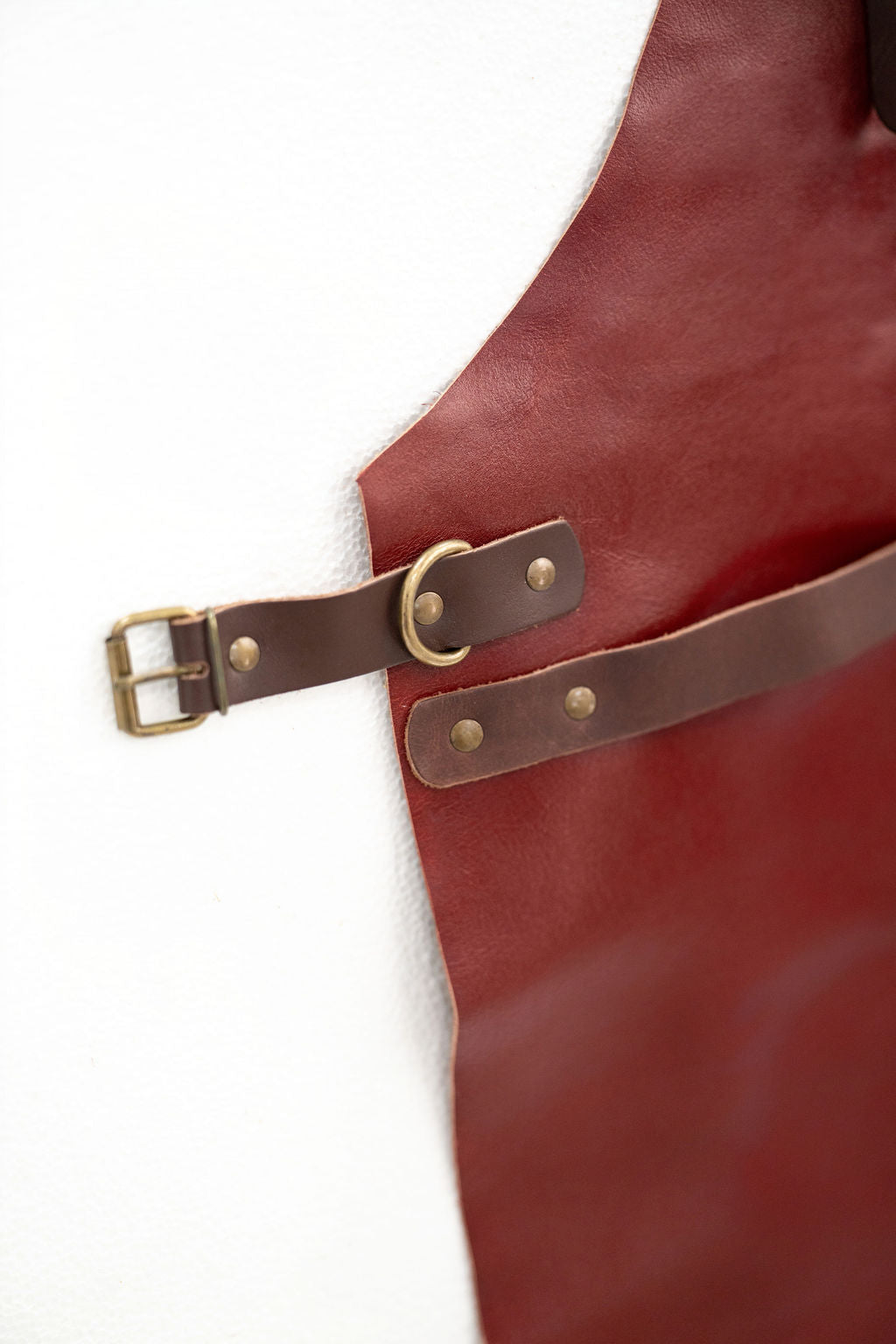 Elegant red leather apron minimal look for cooking and crafting