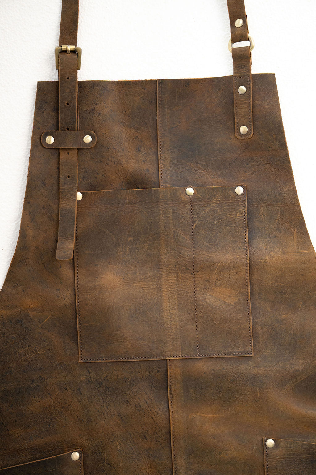 Stylish brown leather work apron with pockets for barbers and makers
