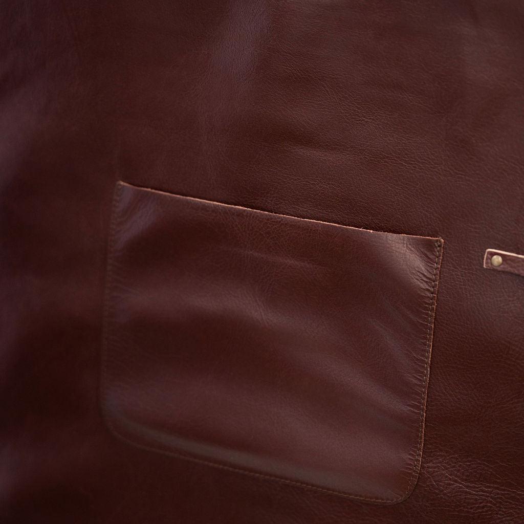 Durable chestnut leather apron with adjustable straps for professional use