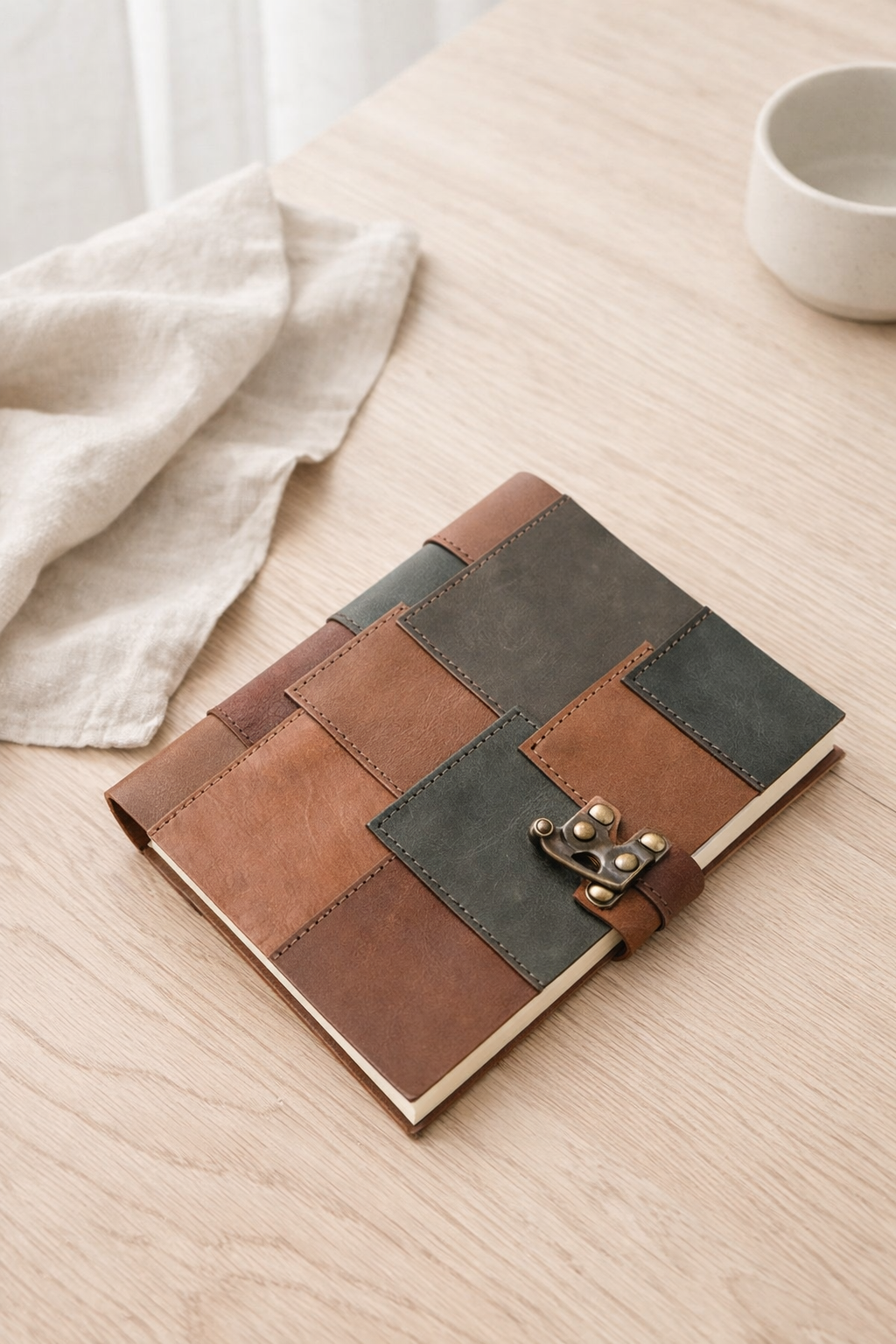 Handcrafted boho leather journal with patchwork cover and vintage clasp, unique notebook for sketching and journaling