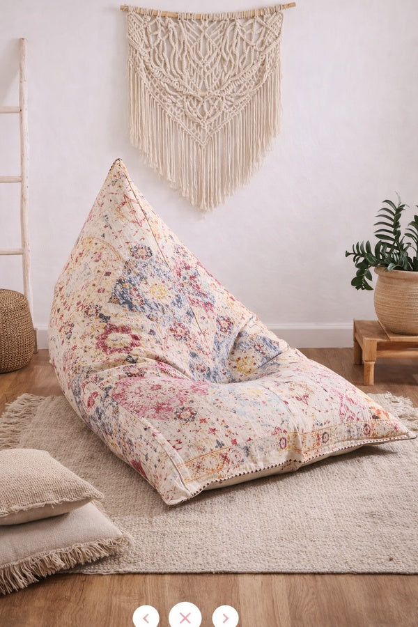 Boho eclectic bean bag lounger with vibrant print for relaxed seating space