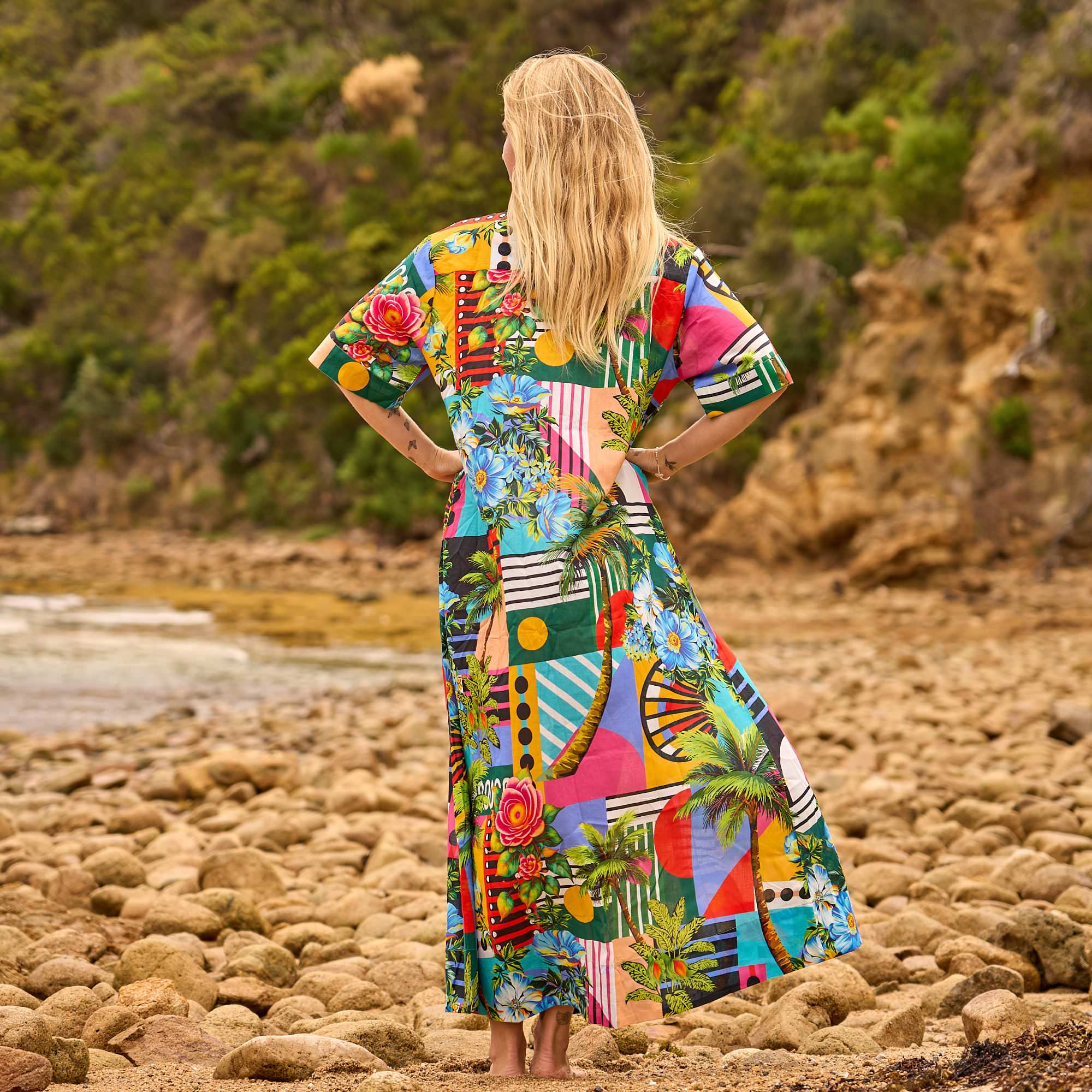 Elegant cotton maxi shirt dress with tropical-inspired print, ideal for resort wear, poolside lounging, and beach outings.
