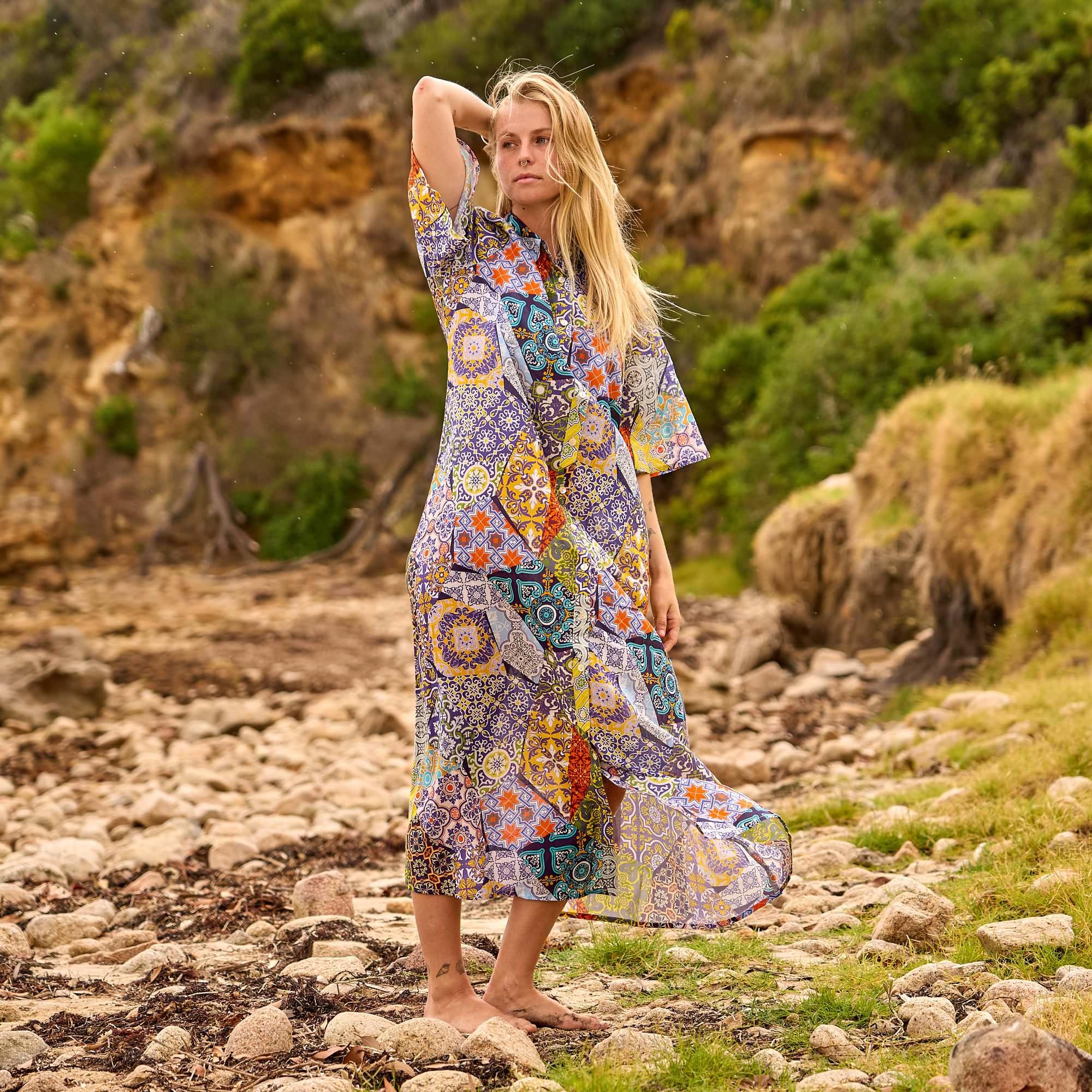 Elegant bohemian patchwork maxi dress with vibrant prints, perfect for travel, vacations, and everyday wear.