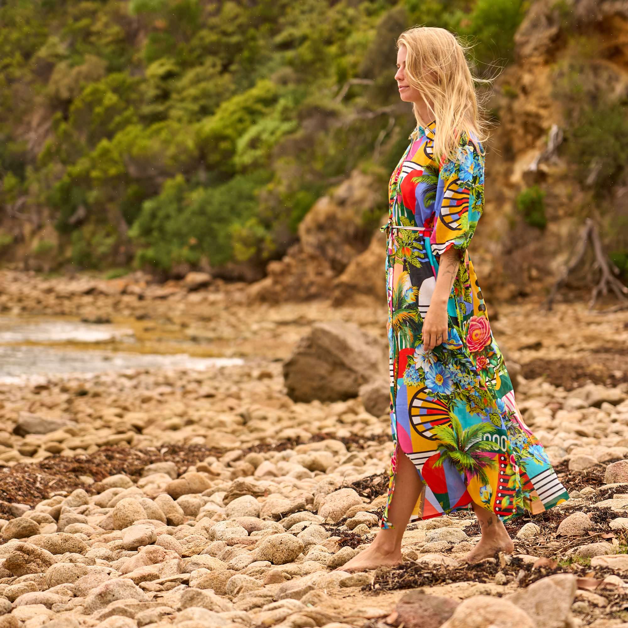 Women's tropical maxi shirt dress featuring vibrant patterns, lightweight fabric, and comfortable resort wear style.
