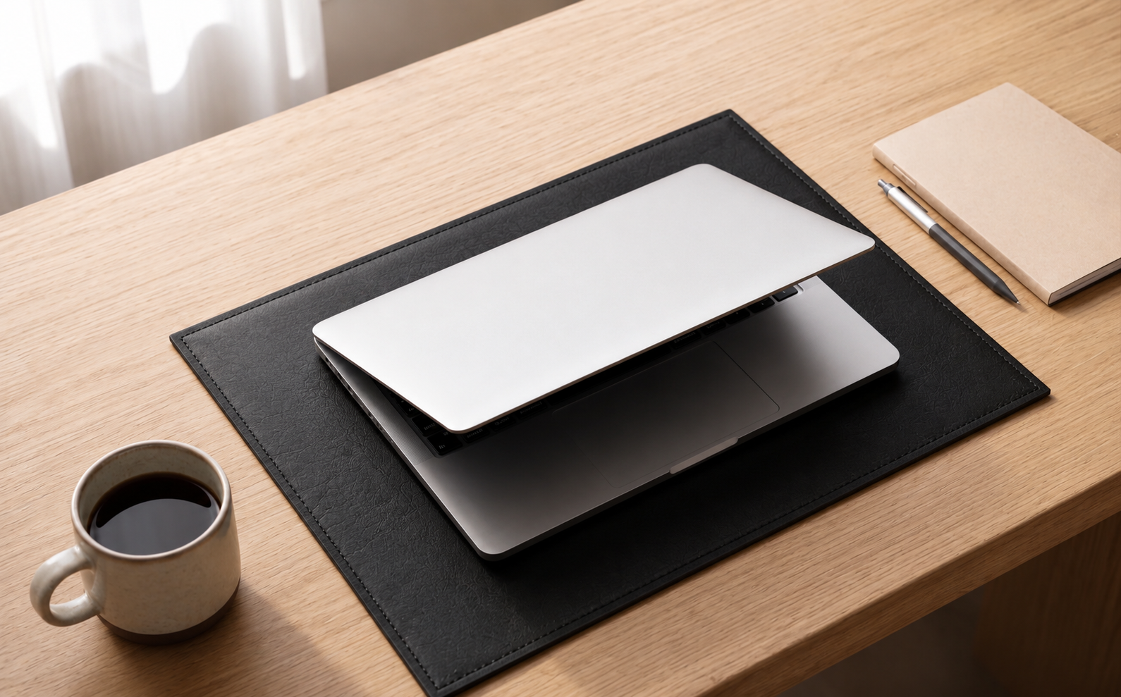 Elegant black leather desk mat and table placemat for laptop and writing use