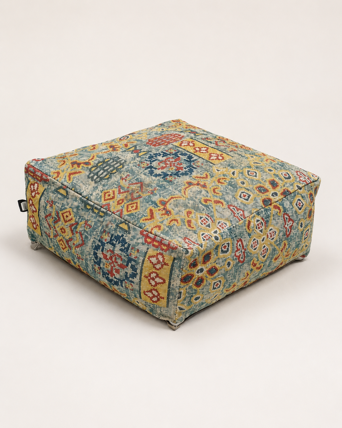 Handwoven tribal pouf with colorful geometric boho pattern