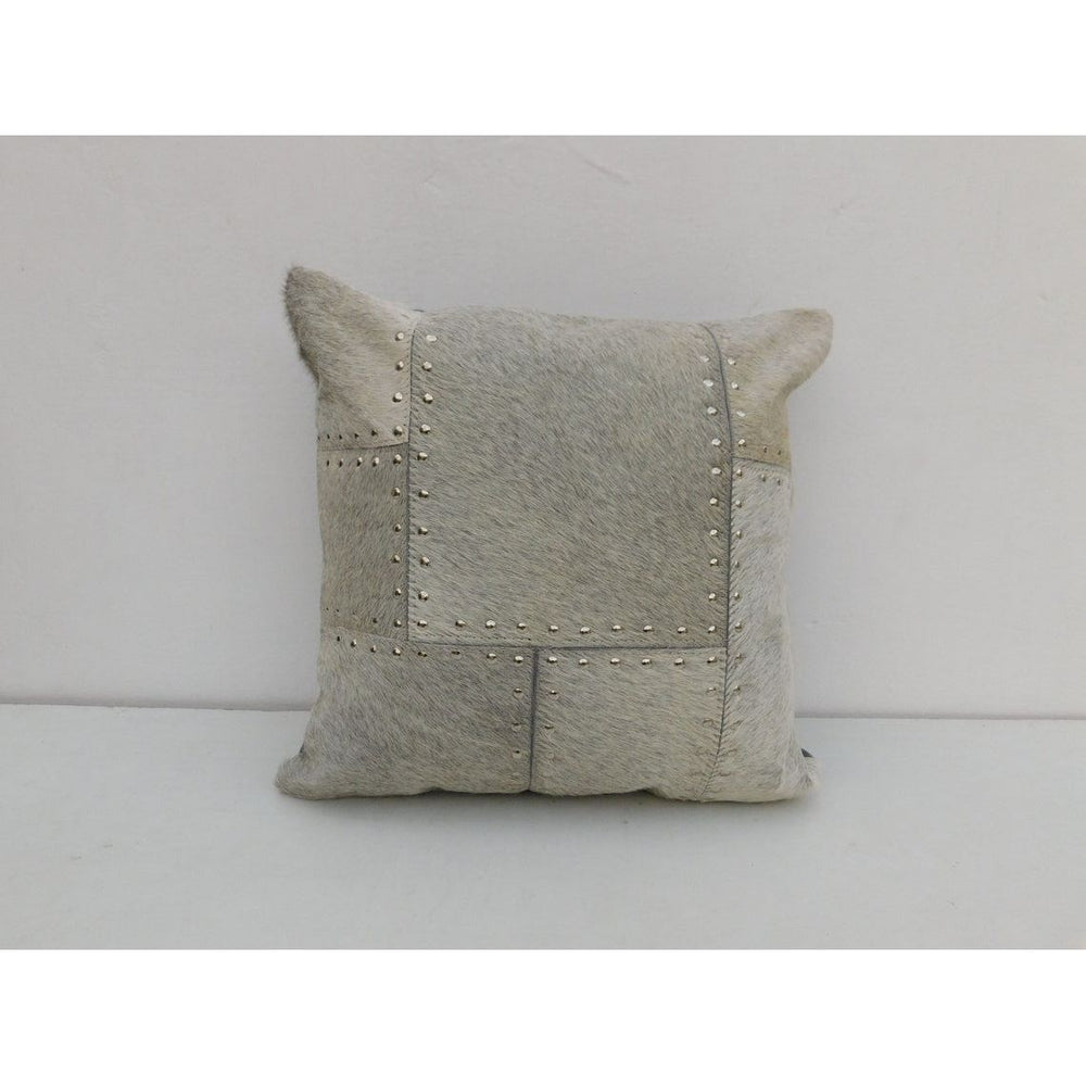 Gray cowhide leather cushion cover with patchwork panels and silver studded detailing, 40x40cm.