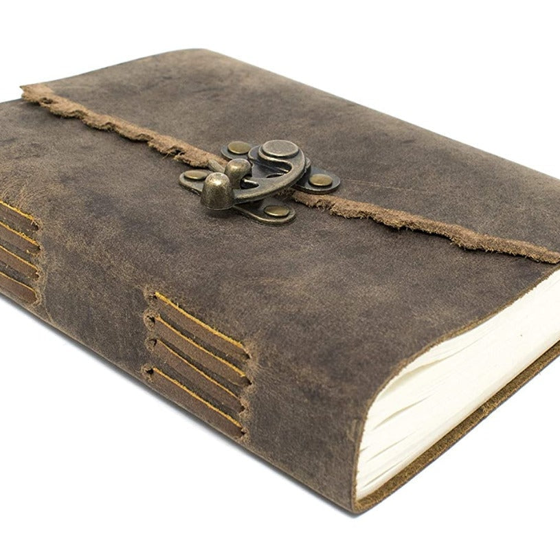Distressed brown genuine leather journal with antique brass C-clasp and visible spine stitching.